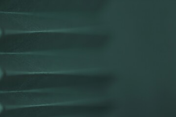 Wallpaper phone background. dark green zigzag abstract background.Sharp crankle surface.blurry scalloped texture.