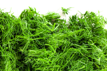 Chopped into small pieces dill isolated on white background, fresh dill