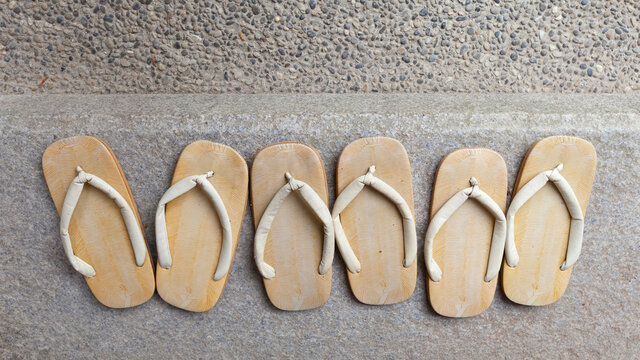 Old Traditional Japanese Sandals shoes on porch.