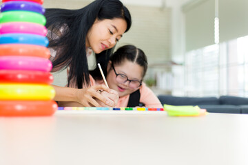 Autism girl with learning practice at home.