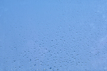 水滴のついたガラスの背景イメージ