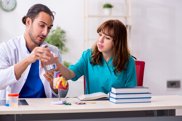 Two doctors colleagues working in the hospital