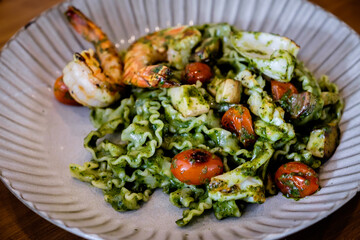 Reginette pasta with seafood pesto sauce