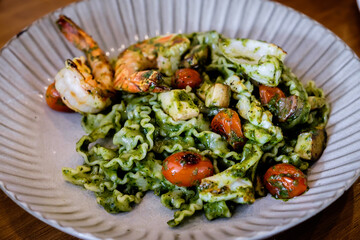 Reginette pasta with seafood pesto sauce