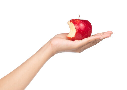 hand holding bite red apple isolated on white background