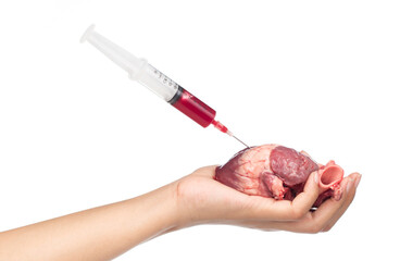 holding blood syringe for injection with raw heart on hand isolated on white background