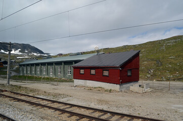 Obraz premium Views from the train window. Mountain tundra of Central Norway. Railway travel in Norway.The Bergen - Oslo train.