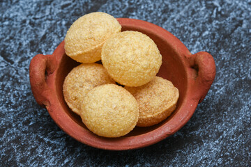Spicy Pani puri golgappe and  potato stuffing, Chat item, India. panipuri, North Indian street food snack served with tangy tamarind water, chaat masala, chickpeas Delhi, Mumbai, Rajasthan, Bangalore