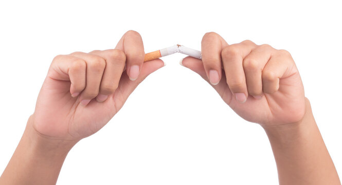 Quit smoking, human hands breaking the cigarette isolated on white background.