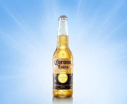 MINSK, BELARUS, june 26, 2020: Chilled bottle of Corona Extra beer bottle of beer on a light blue background.