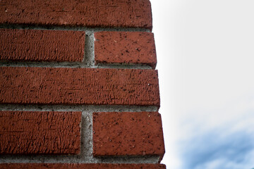 Red brick wall on a cloudy day