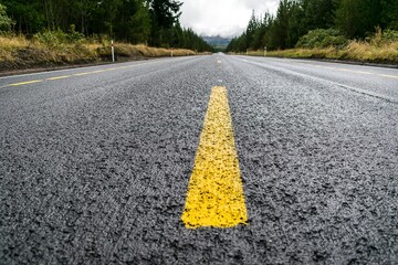 Closeup shot of yellow lines on an empty street