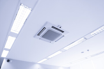 White ceiling mounted cassette type air conditioner for large rooms, exhibition room, for business...