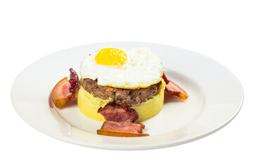 mom made breakfast. fried egg and meat patty on top of smashed potato, decorated with bacon. food isolated on the white background. side view