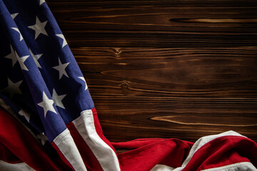 USA Flag Lying on Wooden Background. American Symbolic. 4th of July or Memorial Day of United States. Copy Space for Text