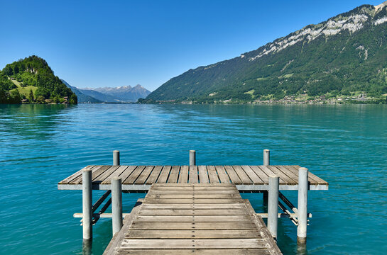 Pier Over Lake Against Blue Sky