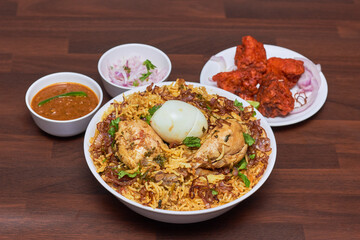 Chicken Biryani is a savory chicken and rice dish that includes layers of chicken, rice, and aromatics that are steamed together