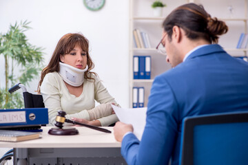 Injured woman and male judge in the courtroom