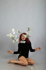 curly girl throwing up money