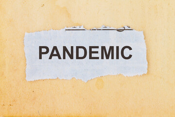 Pandemic word written on a vintage brown paper