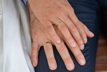 hands of the groom and the bride