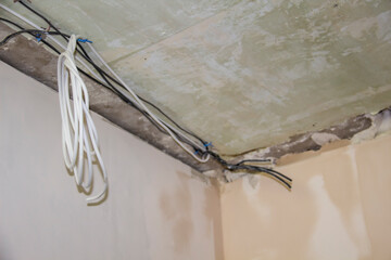 Repair work in the apartment. Concept of home improvement or renovate. Primed painting walls and...