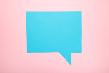 Fototapeta na wymiar Blue paper speech bubbles on pink background