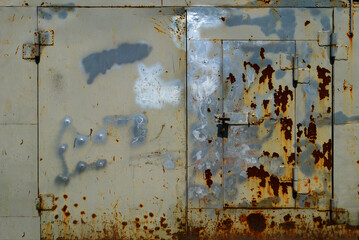 Metal garage doors painted by people as an abstract painting