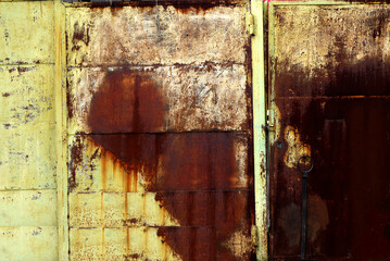 Metal garage doors painted by people as an abstract painting