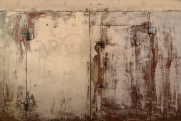 Metal garage doors painted by people as an abstract painting