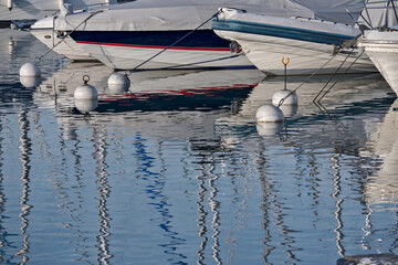 bow of yachts and reflections in a marina, Genevabow of yachts and reflections in a marina, Geneva