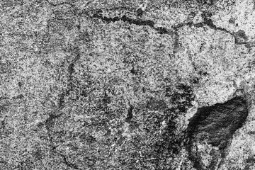 Texture of a concrete wall with cracks and scratches which can be used as a background