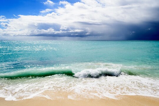 Calm Maho Beach in Sint Maarten, Dutch Caribbean captured on a cloudy day