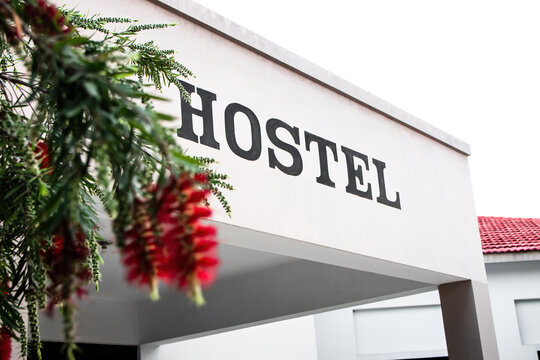 A building with hostel sign. Good place for college life students.