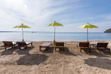 yellow beach umbrella and sunbed, Koh Mak beach, Koh Mak Island , Thailand.