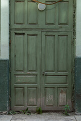 An old dark green wooden door