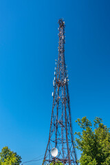 Telecommunication mast with equipment mounted on it.