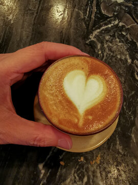 Heart latte art on picolo latte hot coffee
