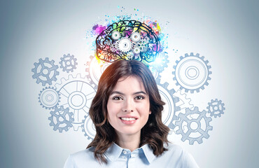 Smiling young business woman brainstorming