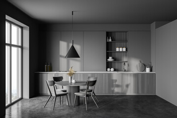 Grey and wooden kitchen with dining table