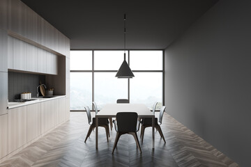 Grey and wooden kitchen with table, side view