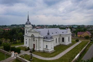 Very beautiful Catholic church in a small village. aerial photography.