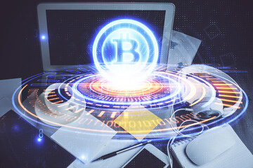 Multi exposure of blockchain and crypto economy theme hologram and table with computer background. Concept of bitcoin cryptocurrency.
