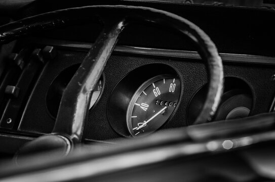 Vintage speedometer in old car.