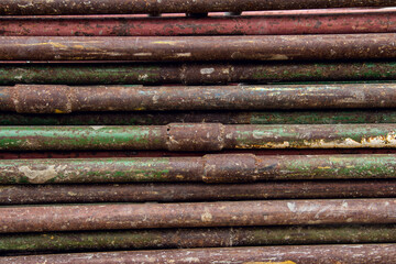 Scaffolding stacked with a stack for storage. Equipment for high-altitude construction work. Steel framework from scaffolding