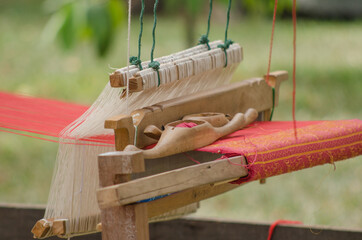 Weaving machines that use human labor in weaving Is an ancient weaving machine that is used by Thai people in weaving.