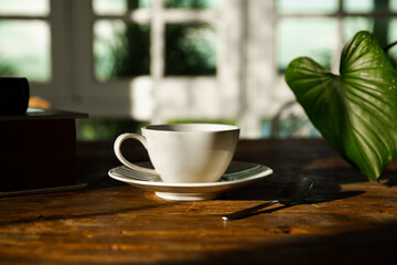 A white coffee mug on a wooden office desk
