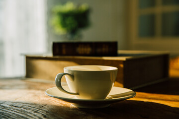 A white coffee mug on a wooden office desk