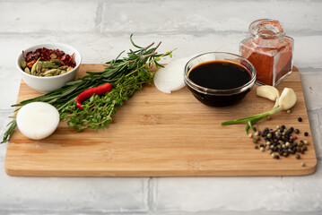 cutting board with spices and seasonings for meat and chicken marinade