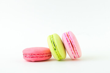 Colorful macarons on white background.